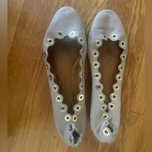 Tan leather scalloped Chloe ballet flats with gold hardware.